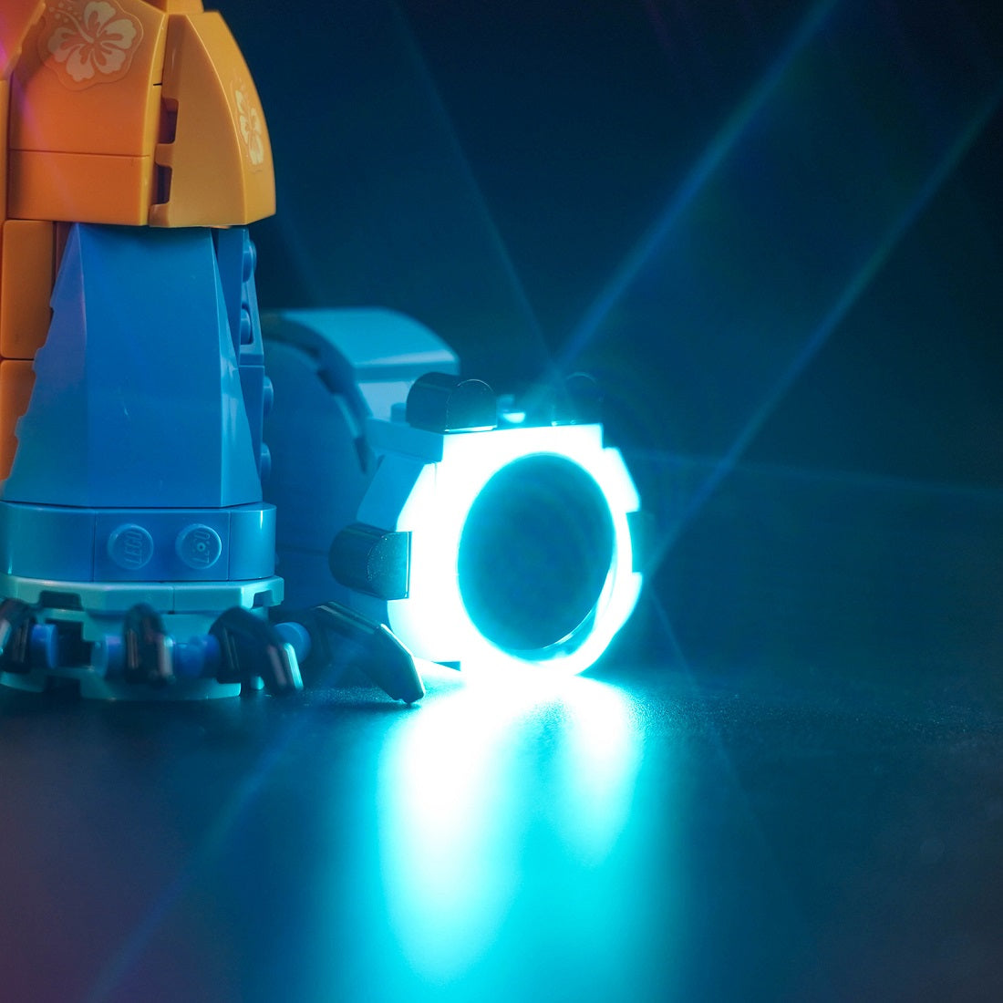 BrickBling custom light kit installed on LEGO Disney Stitch 43249 right foot, enhancing display features.