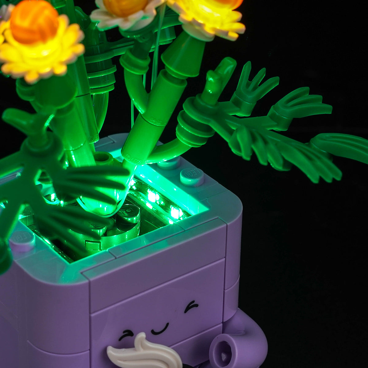 BrickBling LED Light Kit for LEGO Botanicals Cozy Plants 10371 – Side view close-up of the illuminated daisy flowerpot