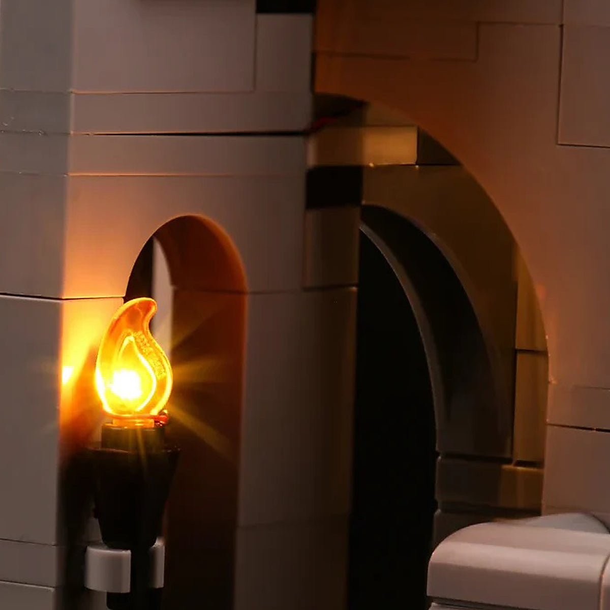 Flame LED light installed in a LEGO castle archway for a warm medieval effect